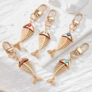 Fashion Alloy Evil Eye Fish Bone Keychain Gold Plated Enamel Skeleton Bag Charm Creative Jewelry Accessory For Unisex Gift