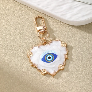 Ethnic heart evil eye keychain with marble texture resin and golden rose metal accents