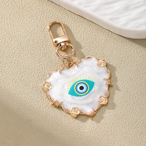 Ethnic Evil Eye heart keychain with white rose embossed pattern and gold lobster clasp