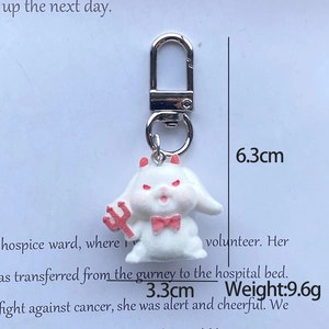 Detail showing cartoon bunny devil keychain dimensions 6.3cm height and 9.6g weight