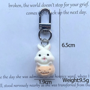 Detailed close-up of a white flocked bunny sitting in a pumpkin base with metal ring