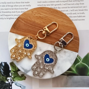 Vintage Alloy Hollow Hamsa Hand Keychain With Heart Evil Eye Rhinestone Pendant Ethnic Style Bag Charm Key Ring For Women