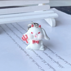 Cute white flocked bunny devil keychain with red horns and trident for Christmas gifts
