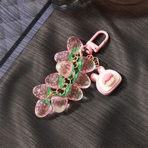 Cute resin strawberry keychain with pink bunny charm and translucent fruit pendants