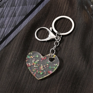Handmade heart-shaped acrylic keychain with real dried colorful flowers inside