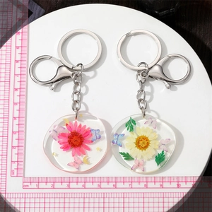 Irregular dried flower resin keychain with butterfly and stars charms in 2pcs set