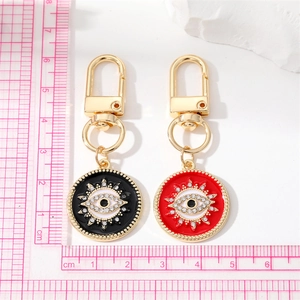 Porte-clés œil protecteur bohème rouge et noir avec accents de cristal et fermoir doré