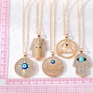 Golden Evil Eye necklaces set with rhinestone Fatima hand and Horus eye pendants
