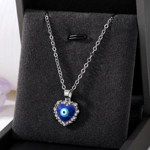 Silver evil eye heart pendant necklace with blue enamel and sparkling rhinestones