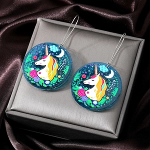 Acrylic round earrings featuring a dreamy unicorn and flower design with silver hooks