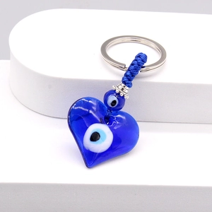 Blue heart-shaped evil eye glass pendant keychain with silver beads and woven cord