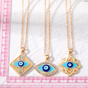 Three gold-plated alloy evil eye pendants with blue enamel and crystal inlay measurements