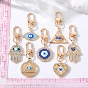 Vintage Hamsa Hand and Evil Eye keychains with crystal rhinestones in gold finish