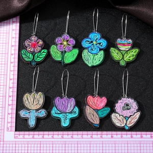 Set of eight colorful acrylic floral drop earrings with vibrant hand-painted patterns