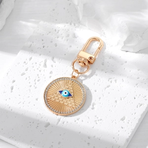 Vintage golden hamsa evil eye pyramid keychain with rhinestones and blue enamel details