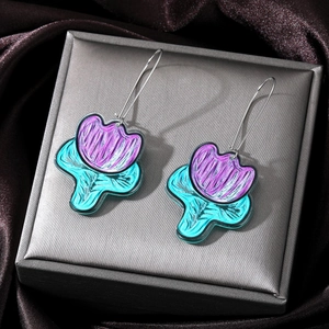 Exquisite purple tulip earrings in acrylic on a grey jewelry box and silk background