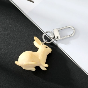Close-up of realistic rabbit texture on keychain with silver metal spring clip