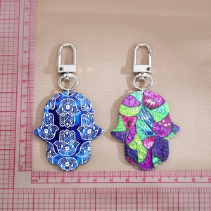 Bohemian Hamsa Hand and Evil Eye keychain set with colorful graffiti patterns and words