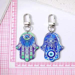Vintage Hamsa Hand and Evil Eye acrylic keychain set with silver lobster clasp on white background