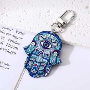 Hamsa Hand Schlüsselanhänger im Ethno-Stil mit blauem Auge und bunten Mustern