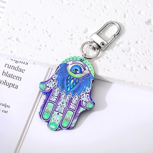 Retro Evil Eye keychain with blue and purple gradient mandala pattern on silver hardware