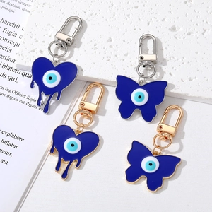 Porte-clés en Alliage Cœur Papillon Mauvais Œil Pendentif en Émail Bleu Bijoux de Mode Anneau pour Accessoires de Sac Femme