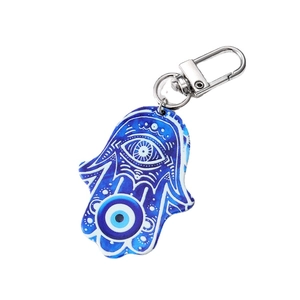 Vintage acrylic Hamsa Hand keychain with Evil Eye pattern on a white background