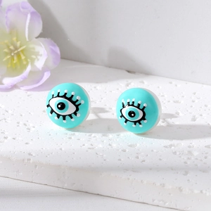 Detail view of turquoise Evil Eye stud earrings featuring hand-painted resin lashes and pupils