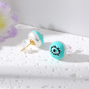Fashionable mint green devil's eye stud earrings with faux pearl backing and gold needles
