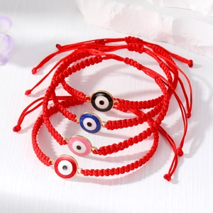 Handmade red braided evil eye bracelet set with adjustable strings and gold accents