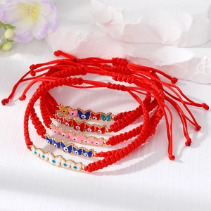 Set of five handmade red braided butterfly evil eye bracelets with enamel charms