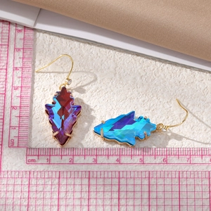 Irregular geometric crystal drop earrings with blue-purple gradient on a pink scale