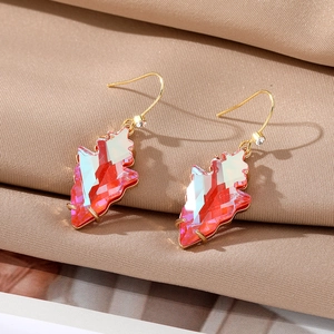 Elegant geometric irregular red crystal leaf earrings with gold finish on silk background