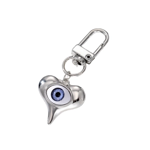 Silver heart keychain with blue evil eye pendant and metal spring clasp on white background