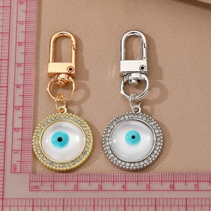 Blue Evil Eye keychains in gold and silver finish with rhinestones measuring 7.5cm