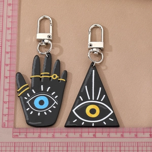 Vintage Fatima hand and triangle evil eye keychain charms with ruler for scale