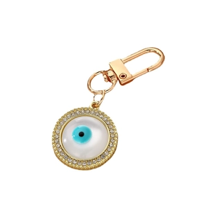 Golden Evil Eye keychain with round crystal pendant and spring ring clasp on white background