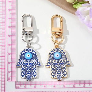 Vintage Hamsa Hand and Evil Eye keychain in gold and silver alloy with lobster clasp