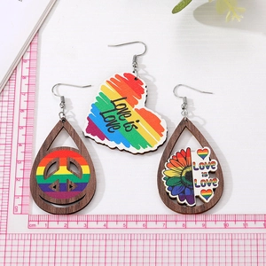 Retro wooden teardrop earrings with rainbow love heart and peace sign symbols