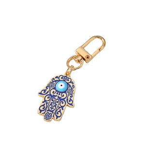 Vintage Hamsa Hand and Evil Eye keychain in golden alloy with blue enamel finish