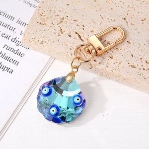 Gradient crystal shell keychain with Evil Eye patterns and a golden lobster clasp