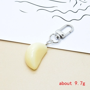Realistic garlic clove keychain pendant with a silver spring clasp for bag charms