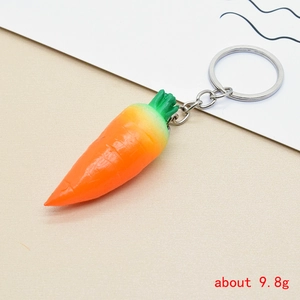 Detail view of creative resin carrot keychain with green leaf and silver metal ring