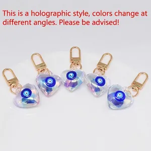 Ciondolo a cuore in acrilico laser con design evil eye e chiusura a moschettone