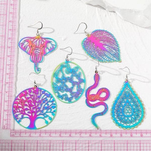 Rainbow iridescent tree of life and leaf dangle earrings in colorful metal plating