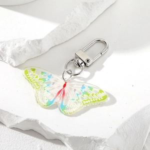 Retro bunter Acryl Schmetterling Schlüsselanhänger mit Farbverlauf auf weißem Fels