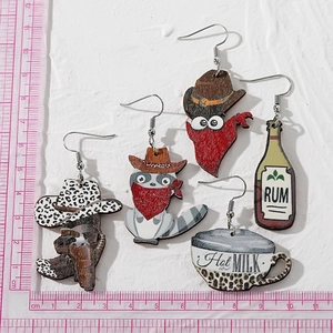 Set of five wooden Western earrings featuring raccoon, cowboy hat, and milk cup designs