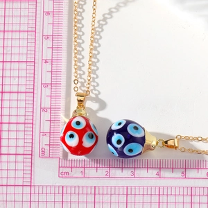 Vintage evil eye necklaces with red and blue glass waterdrop pendants on gold chains