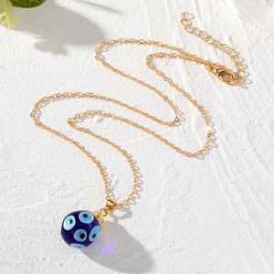 Vintage evil eye pendant necklace with blue glass sphere and gold stainless steel chain