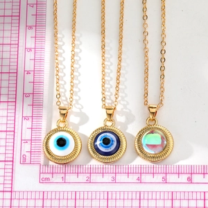 Collier pendentif œil de Turquie vintage doré avec un design rond et géométrique